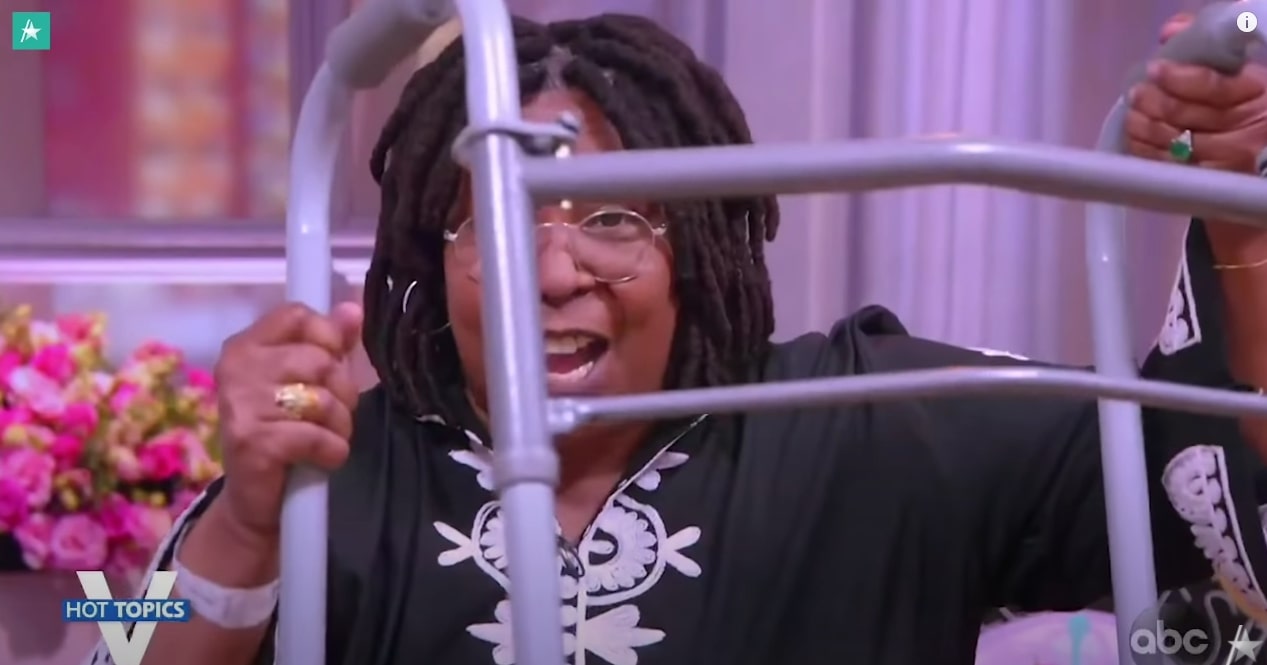 Whoopi Goldberg holding up her walker the view