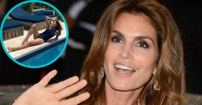 Cindy Crawford poses poolside