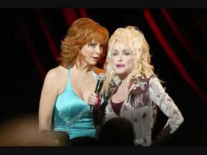 Reba McEntire and Dolly Parton team up for "Does He Love You"