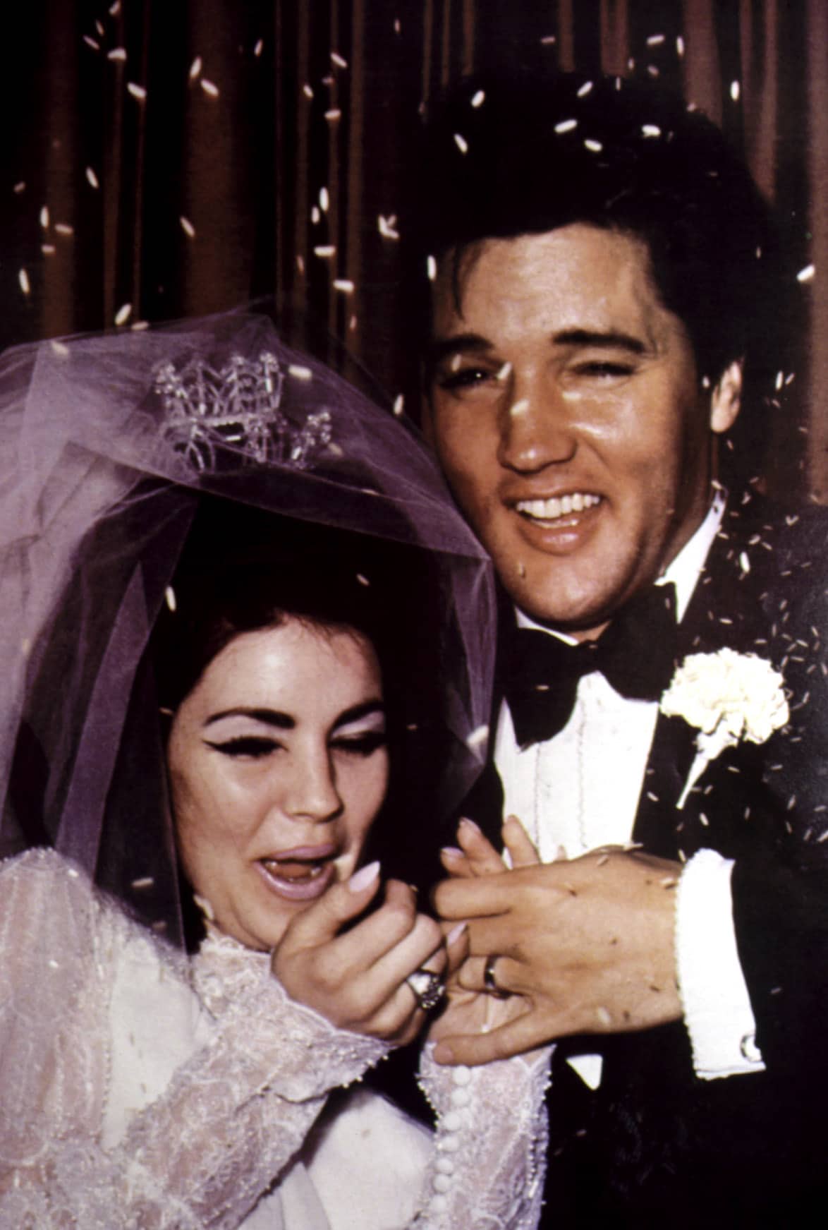Newlyweds PRISCILLA PRESLEY and ELVIS PRESLEY get pelted with rice, 1967