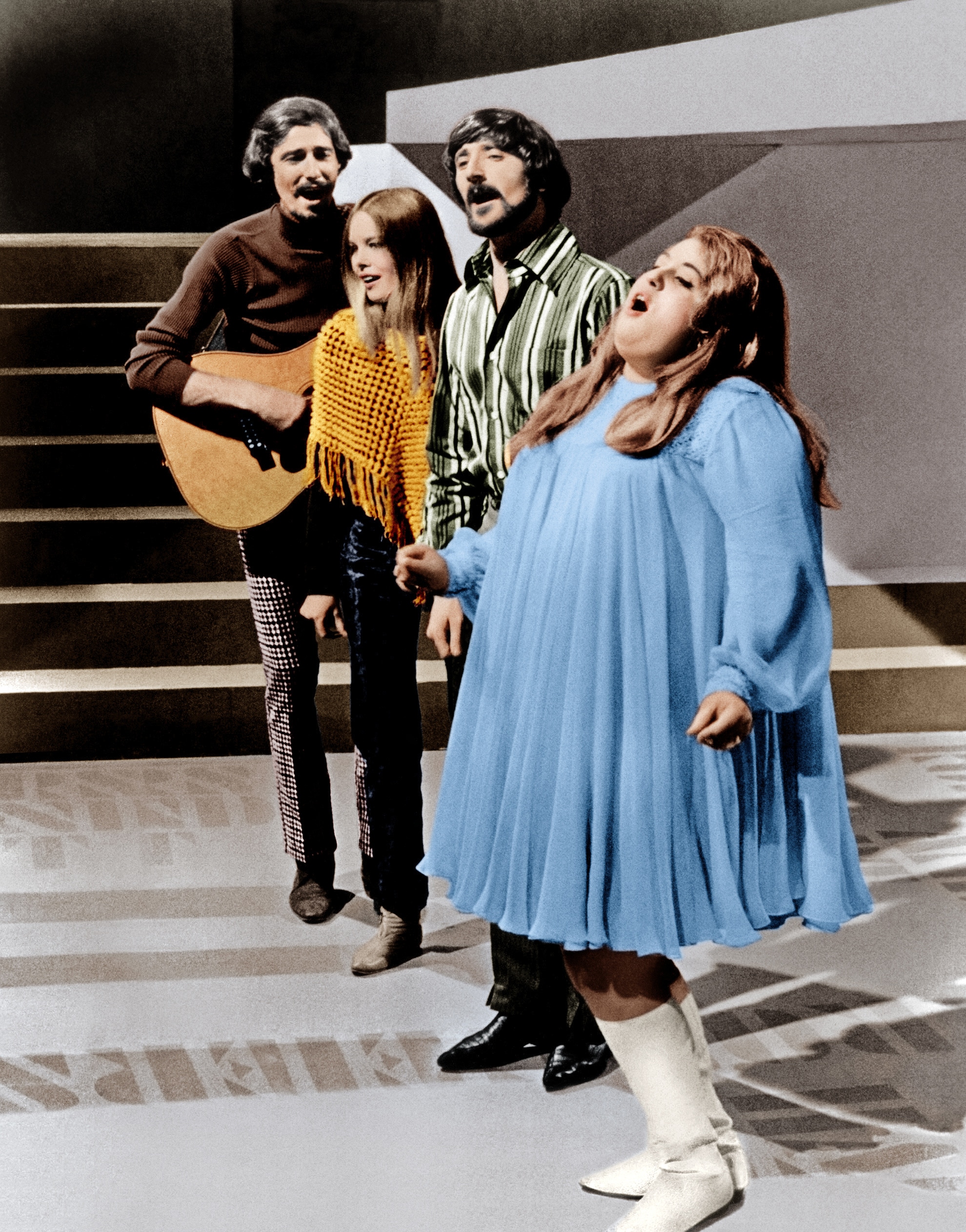 The Mamas and The Papas (from left: John Phillips, Michelle Phillips, Denny Doherty, Cass Elliot aka Mama Cass), performing on an unknown television show, ca. 1966
