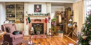 The impressive wood-burning fireplace is framed by bookcases