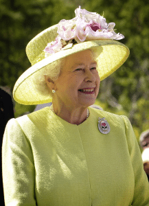 The queen was seen smiling to match her soft yellow attire during her video call