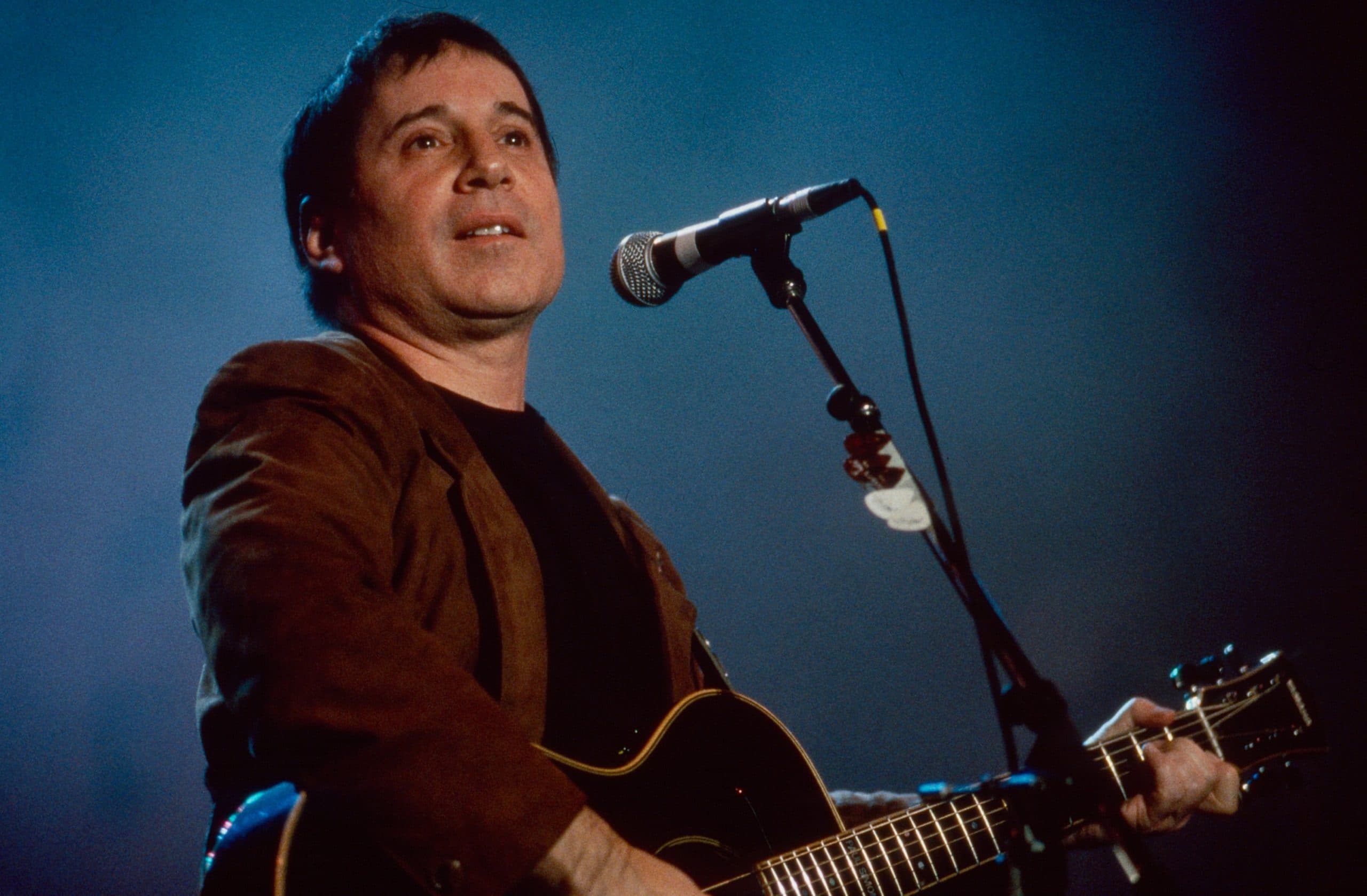 FARM AID, Paul Simon performing at the fifth annual Farm Aid benefit concert, Texas Stadium, Irving, Texas, March 14, 1992