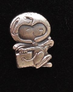 A Silver Snoopy pin bestowed to NASA staff celebrating successful missions