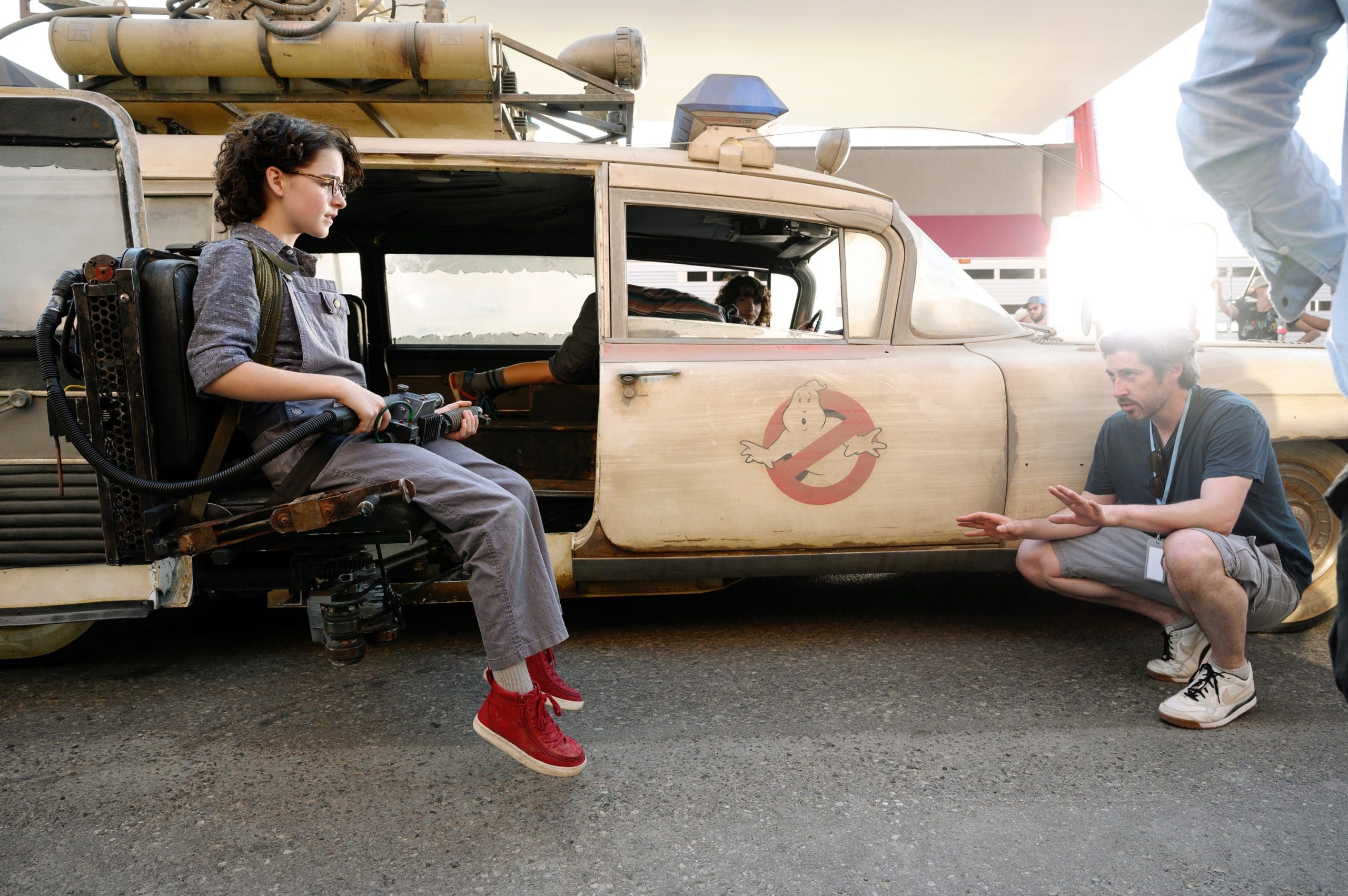 GHOSTBUSTERS: AFTERLIFE, from left: Mckenna Grace, director Jason Reitman, on set, 2021