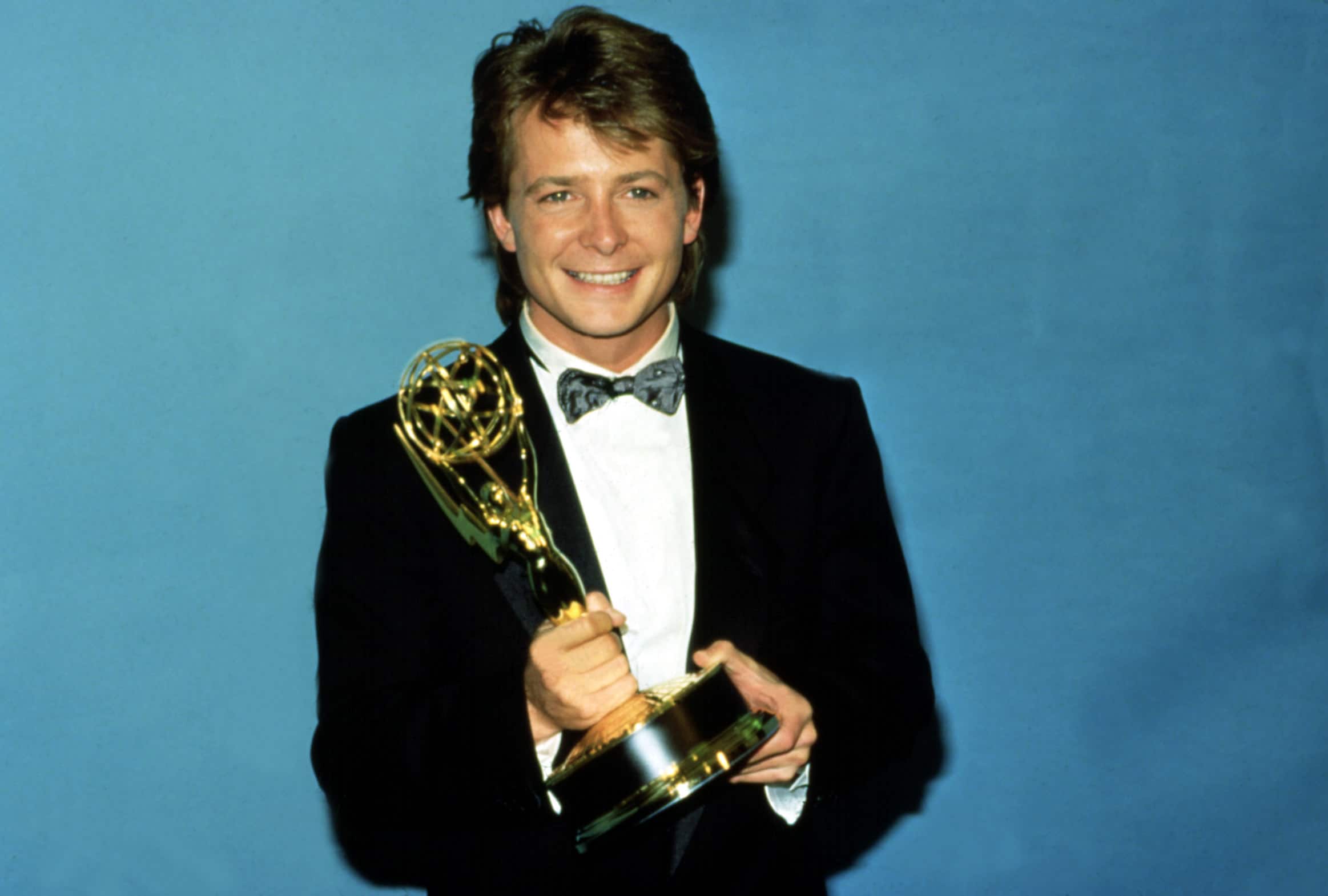 Michael J. Fox with his Emmy Award, 1987