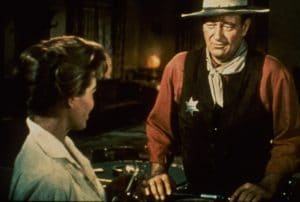 RIO BRAVO, from left: Angie Dickinson, John Wayne