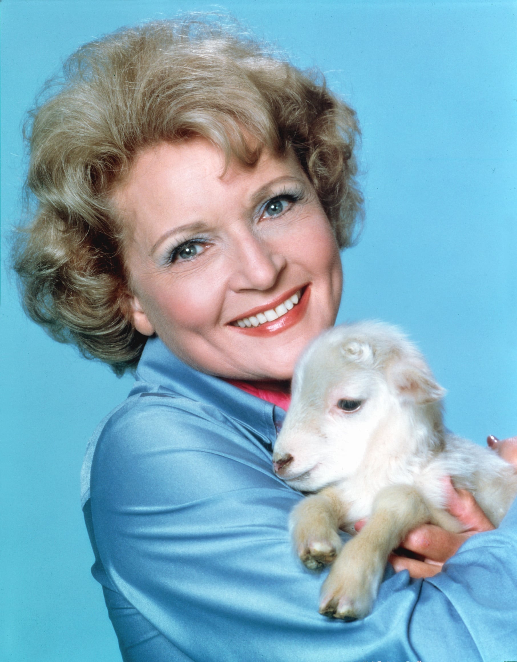 Betty White with a baby goat