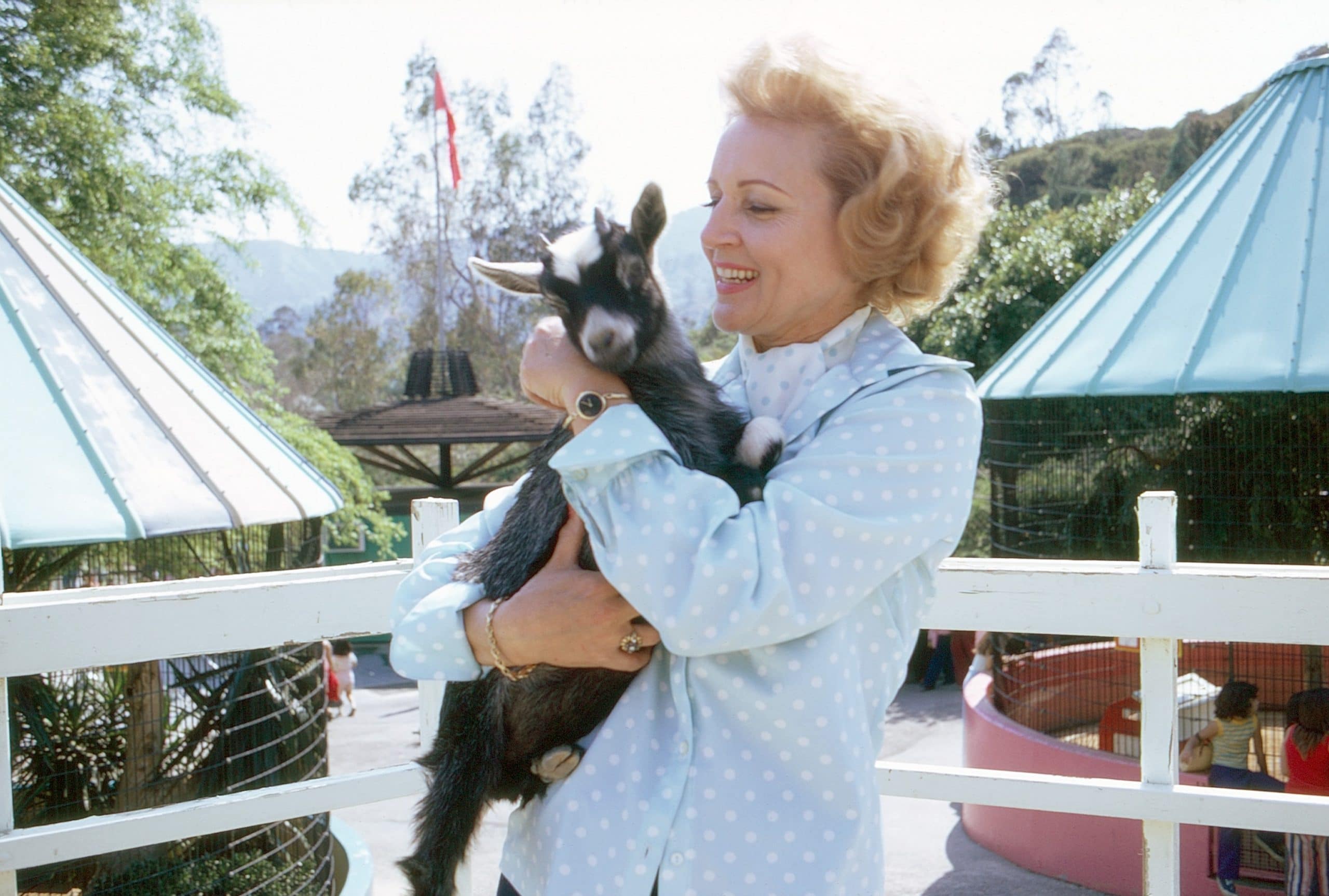 Betty White, holding a baby goat, 1974