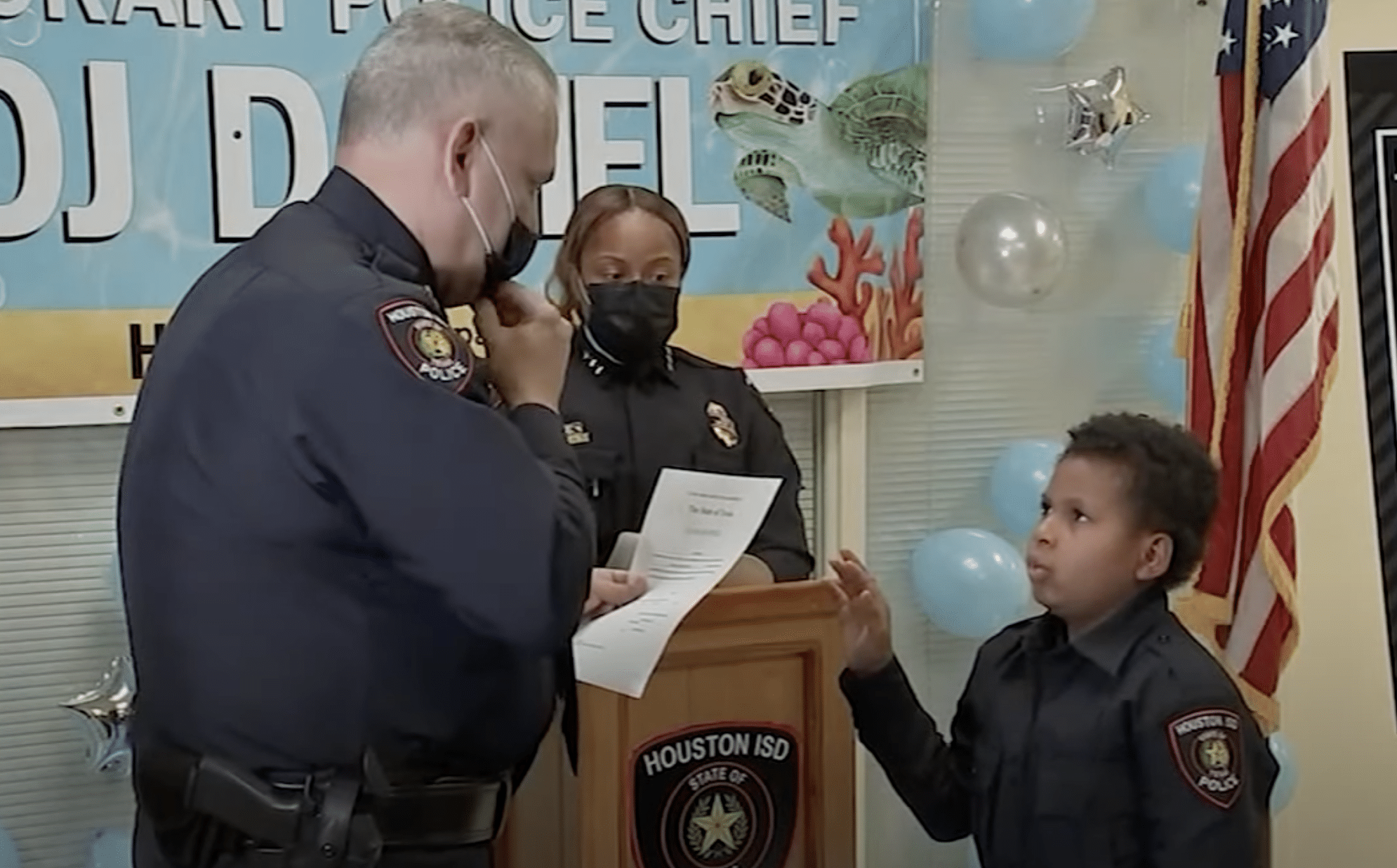 D.J. takes an oath getting sworn into law enforcement agency