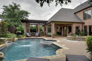 Permits indicate Landon added a pool to the property similar to this one though without the curved corners
