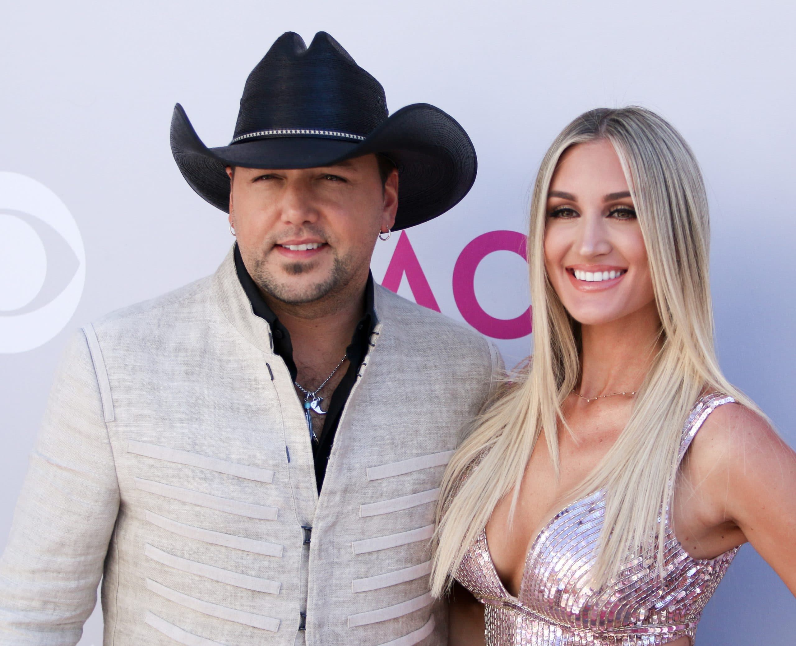 Jason Aldean (L) and wife Brittany Kerr