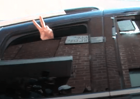 Michael Jackson flashes peace sign on the way to court in 2009