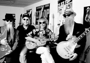 ZZ Top (l to r) Dusty Hill, Frank Beard (with guitar), Billy Gibbons