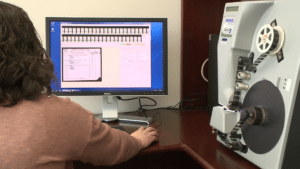 Staff members carefully scanned microfilm reels of the 1950 U.S. census