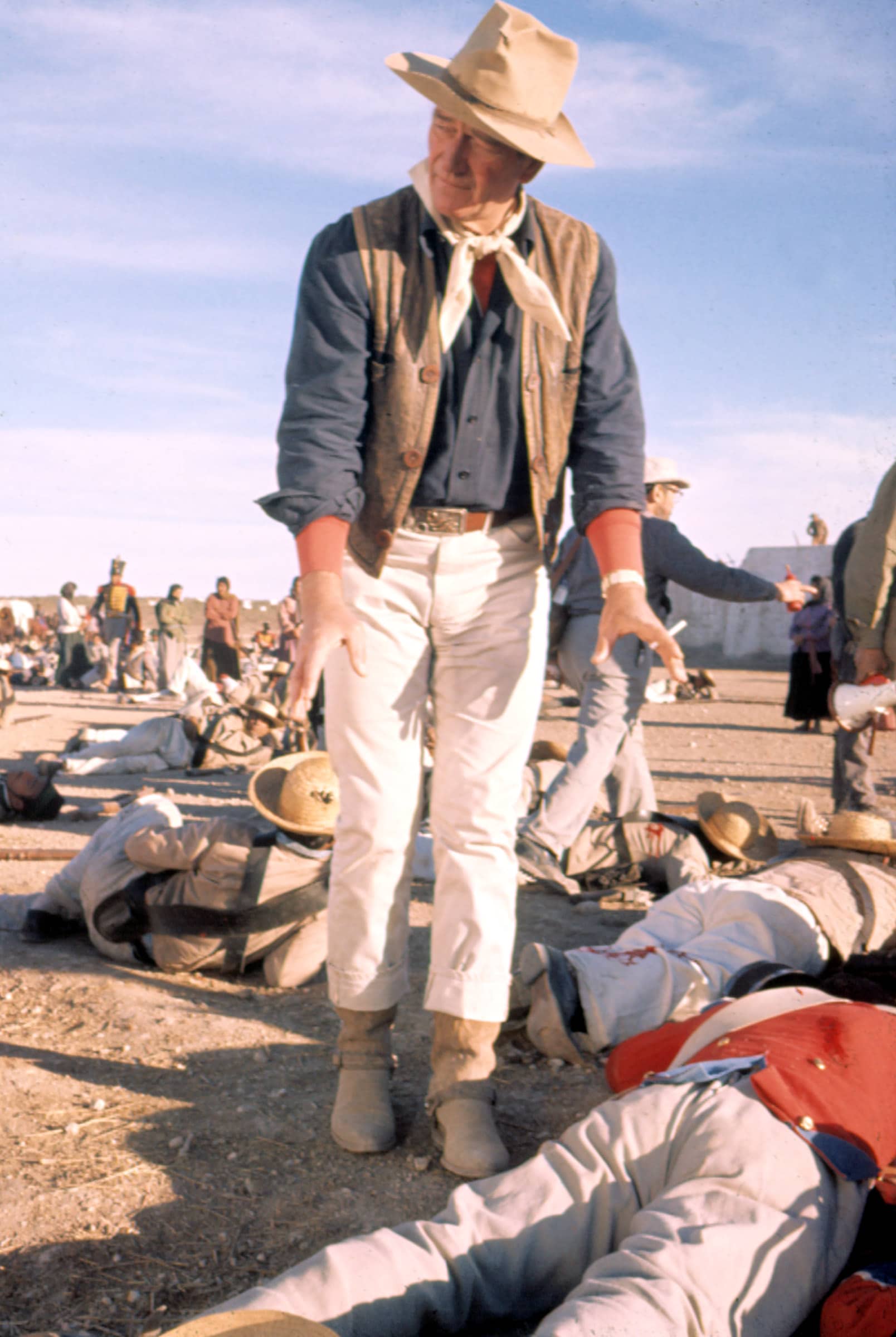 THE ALAMO, Director John Wayne, on set, 1960