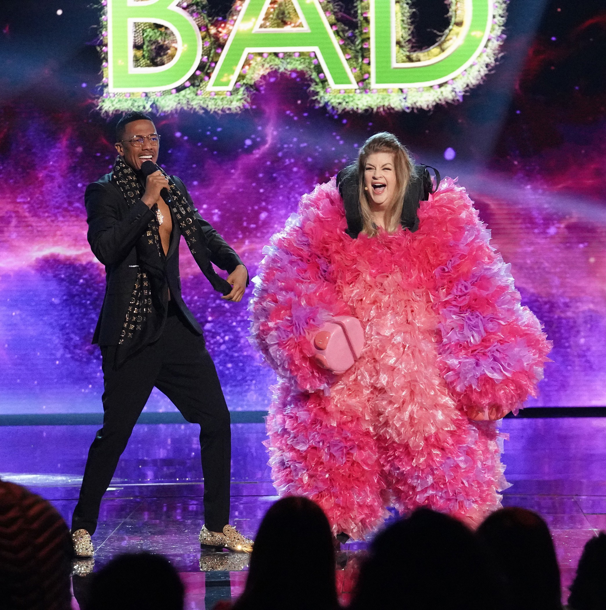THE MASKED SINGER, from left: host Nick Cannon, Kirstie Alley (revealed as Baby Mammoth), The Mask of Least Resistence - Round 3' 
