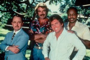 MAGNUM P.I., from left: John Hillerman, Tom Selleck, Larry Manetti, Roger E. Mosley