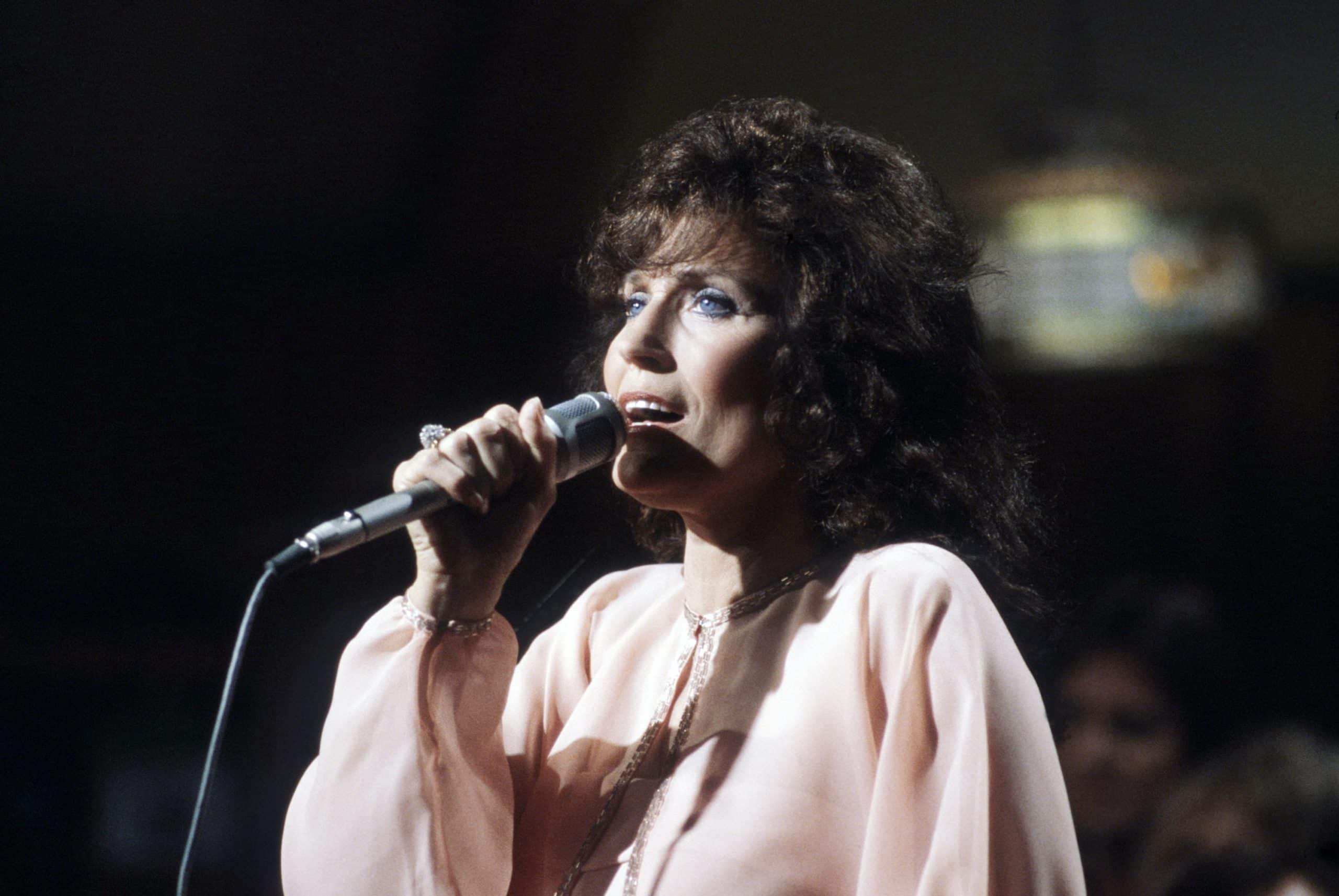 Loretta Lynn, singing, circa 1980s