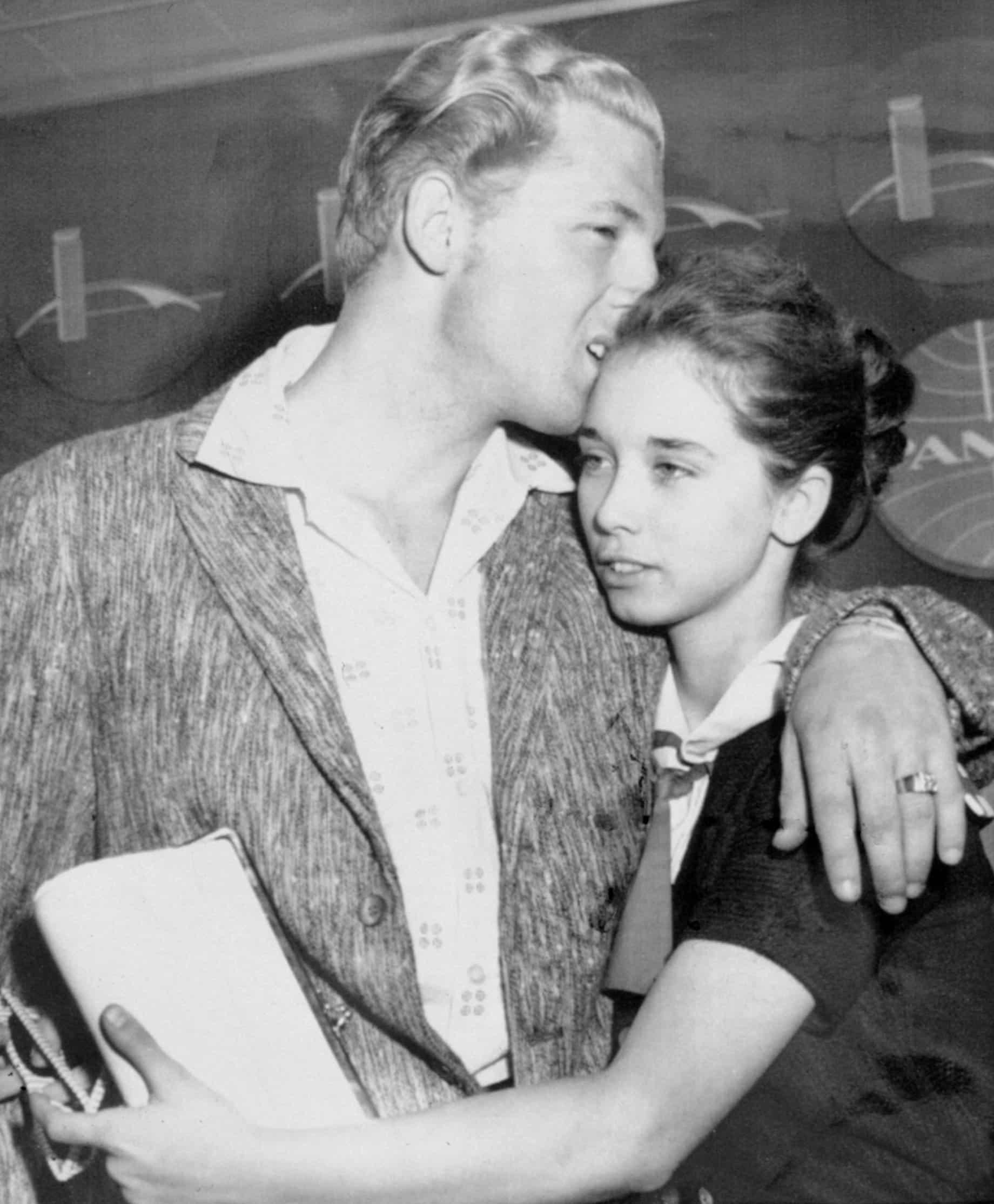 Jerry Lee Lewis kisses his bride Myra, age 13, NYC, 05-28-58