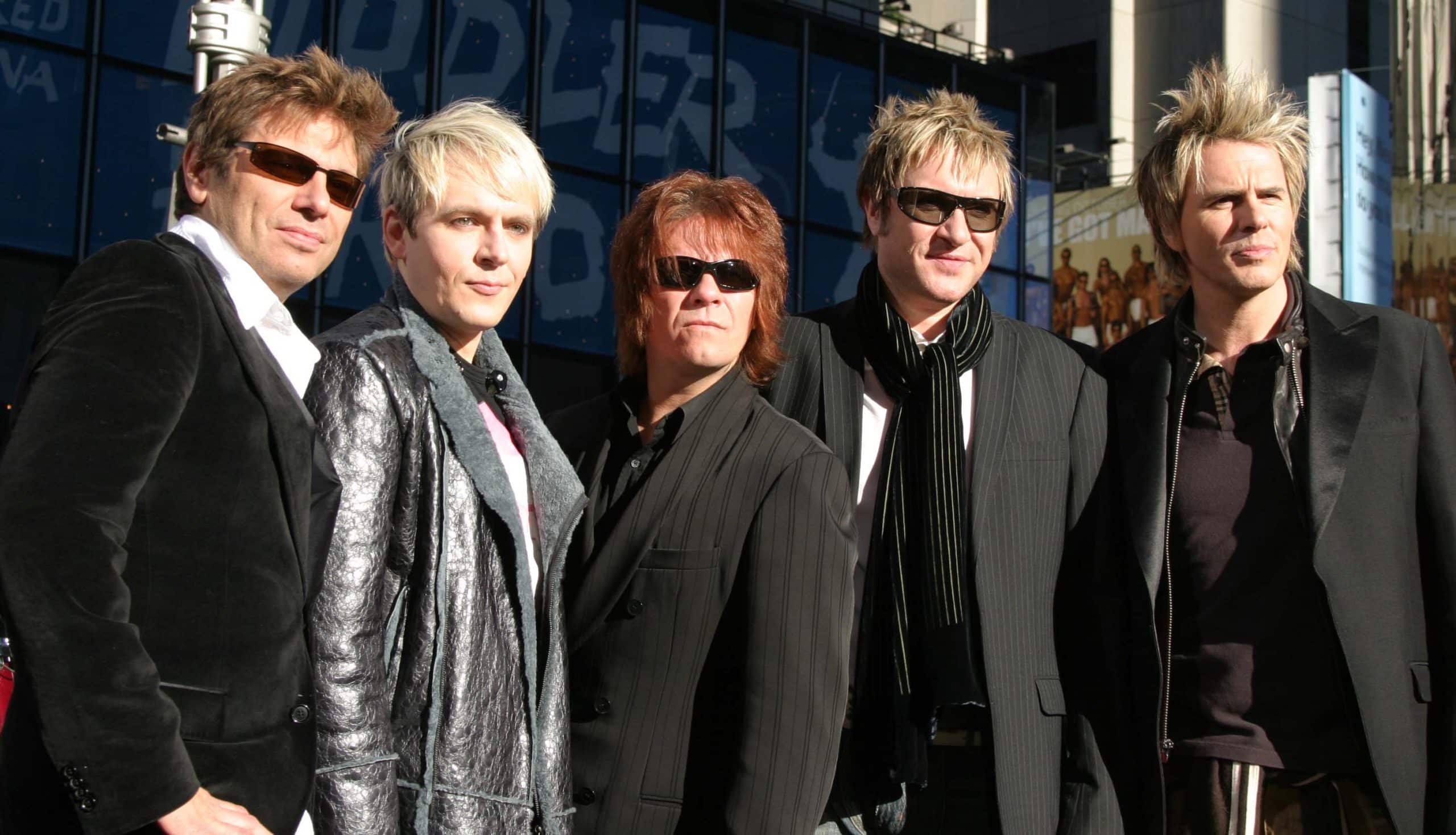 NYC 10/12/04 Bandmembers of DURAN DURAN: Simon Le Bon, Nick Rhodes, John Taylor, Andy Taylor and Roger Taylor performing on Good Morning America in Times Square