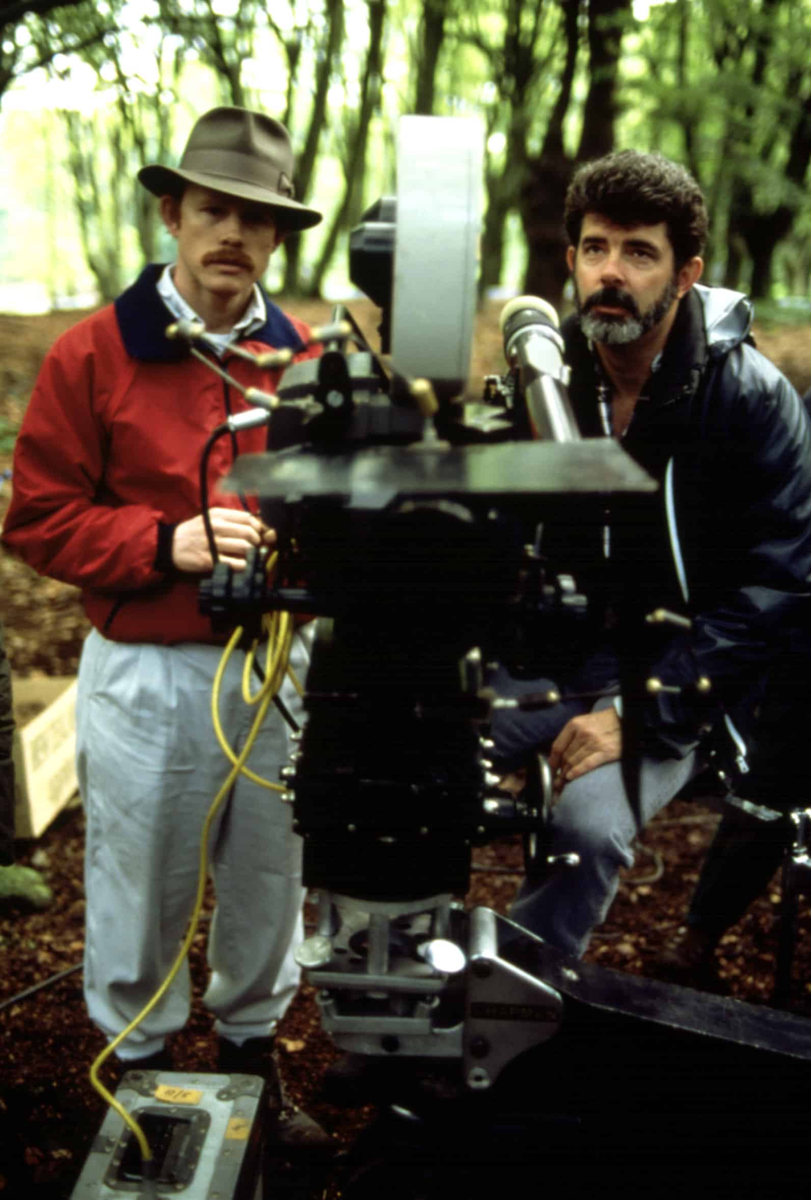 Director Ron Howard and producer George Lucas on the set of WILLOW, 1988
