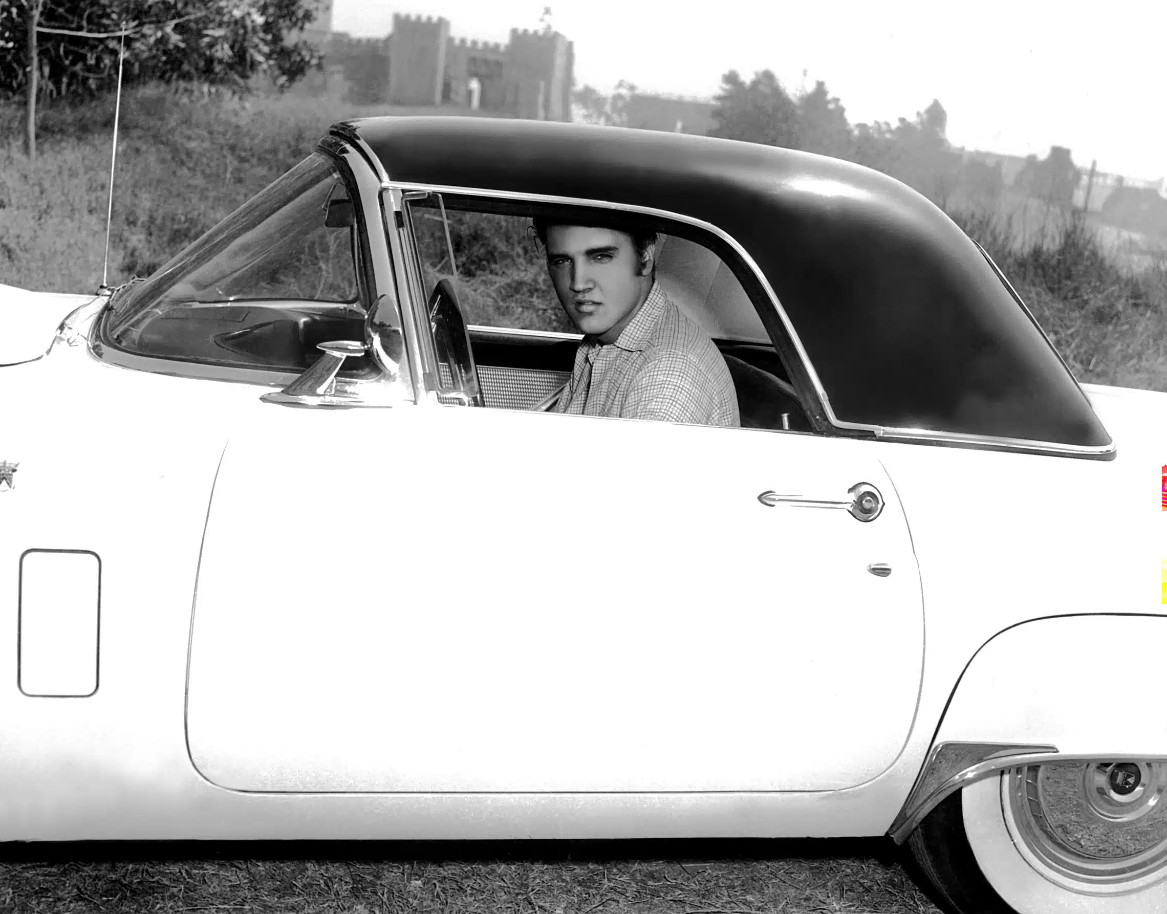 ELVIS PRESLEY, in a 1950s Ford Thunderbird