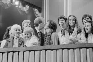 1976 Democratic Convention. Jimmy and Rosalynn Carter kissing, surrounded by family, including young daughter Amy and mother Lillian Carter