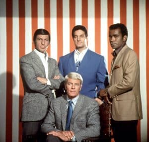 The cast of Mission Impossible. Pictured: Leonard Nimoy, Peter Graves (sitting), Peter Lupus, Greg Morris
