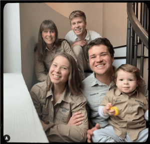 A family photo of Wildlife Warriors Terri, Robert, Bindi, Chandler, and Grace