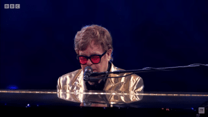Elton John grew tearful as he celebrated his departed colleague and friend, George Michael