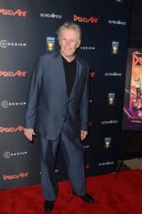 Busey allegedly backed his car into another vehicle then tried to leave