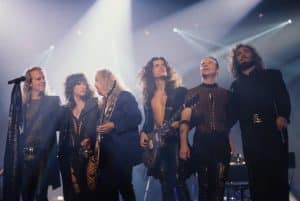 MTV TENTH ANNIVERSARY SPECIAL, Aerosmith, from left: Tom Hamilton, Steven Tyler, Bradley Whitford, Joe Perry, Joey Kramer; Michael Kamen
