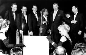 From left, Peter Lawford, Frank Sinatra, Dean Martin, Sammy Davis, Jr., Sands Hotel producer Jack Enratter, Joey Bishop