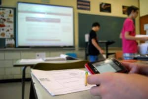 Teachers want parents to help stop texting in class, while mom and dad contribute to the dilemma