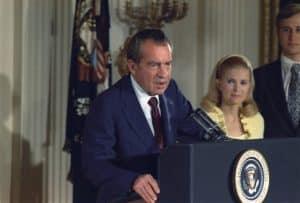 Richard Nixon addressing his Cabinet and White House staff after his resignation of the Presidency. At left are Edward and Tricia Nixon Cox