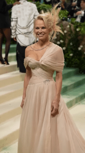 Pamela Anderson stepped out on the Met Gala red carpet bedecked in an elegant cream-colored gown