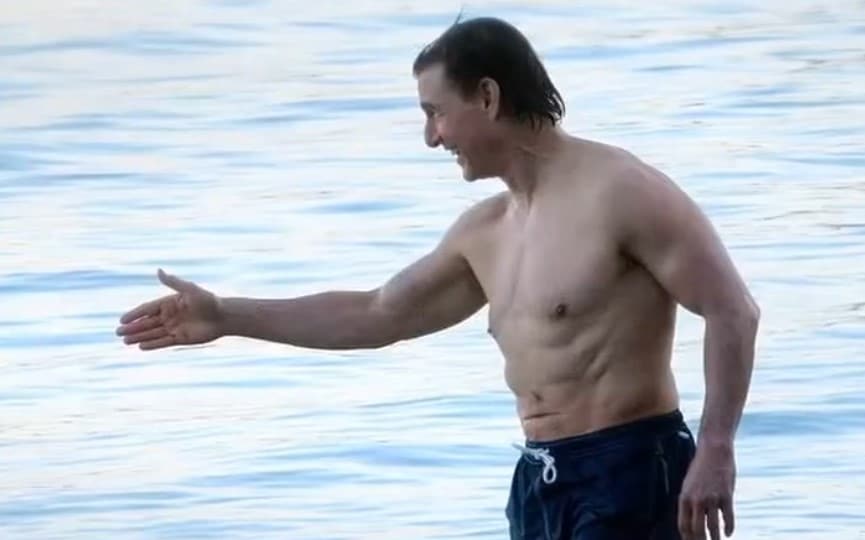 Tom Cruise flaunts abs