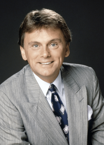 why did Pat sajak replace chuck woolery