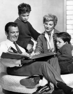 Jerry Mathers, Barbara Billingsley, and Hugh Beaumont pose together in a classic Leave It to Beaver promotional photo.