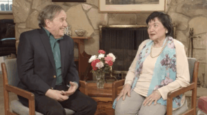 Jerry Mathers smiling beside his 98-year-old mother 