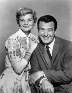 Barbara Billingsley and Hugh Beaumont smiling on set during a Leave It to Beaver