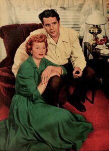Lucille Ball and Desi Arnaz during an off-camera moment, dressed casually in 1950s attire